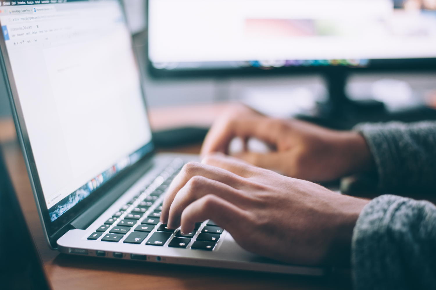 Developer typing code on a keyboard